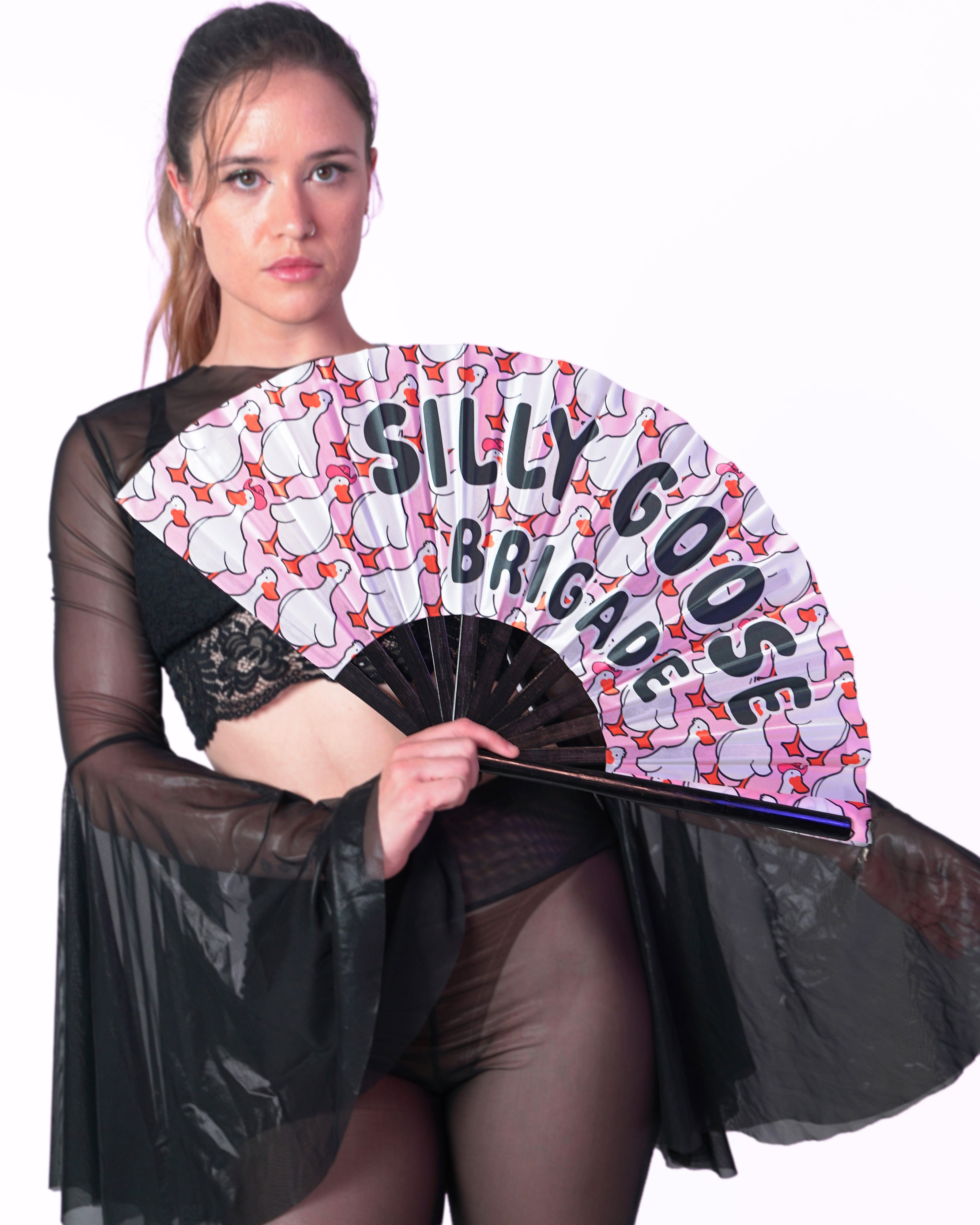 Woman holding a fan with 'Silly Goose Brigade' text against a white background