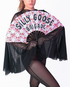 Person holding a fan with 'Silly Goose Brigade' text and goose design on a white background